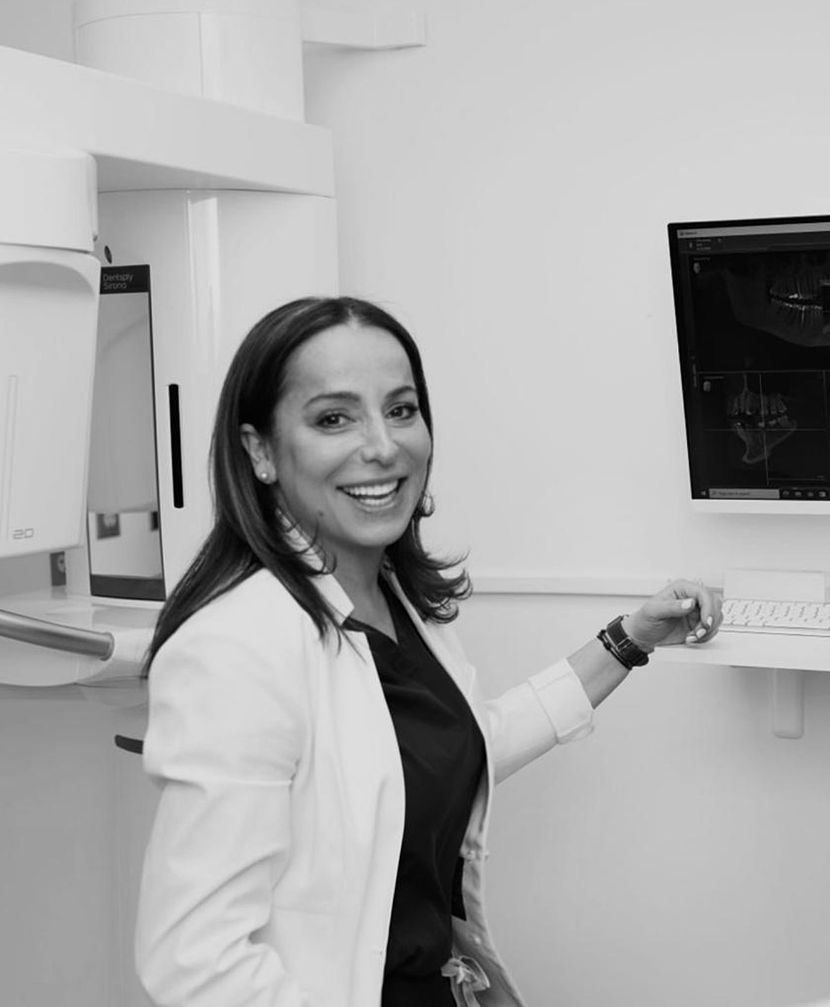 washington, dc invisalign dentist smiling in a doctor's coat